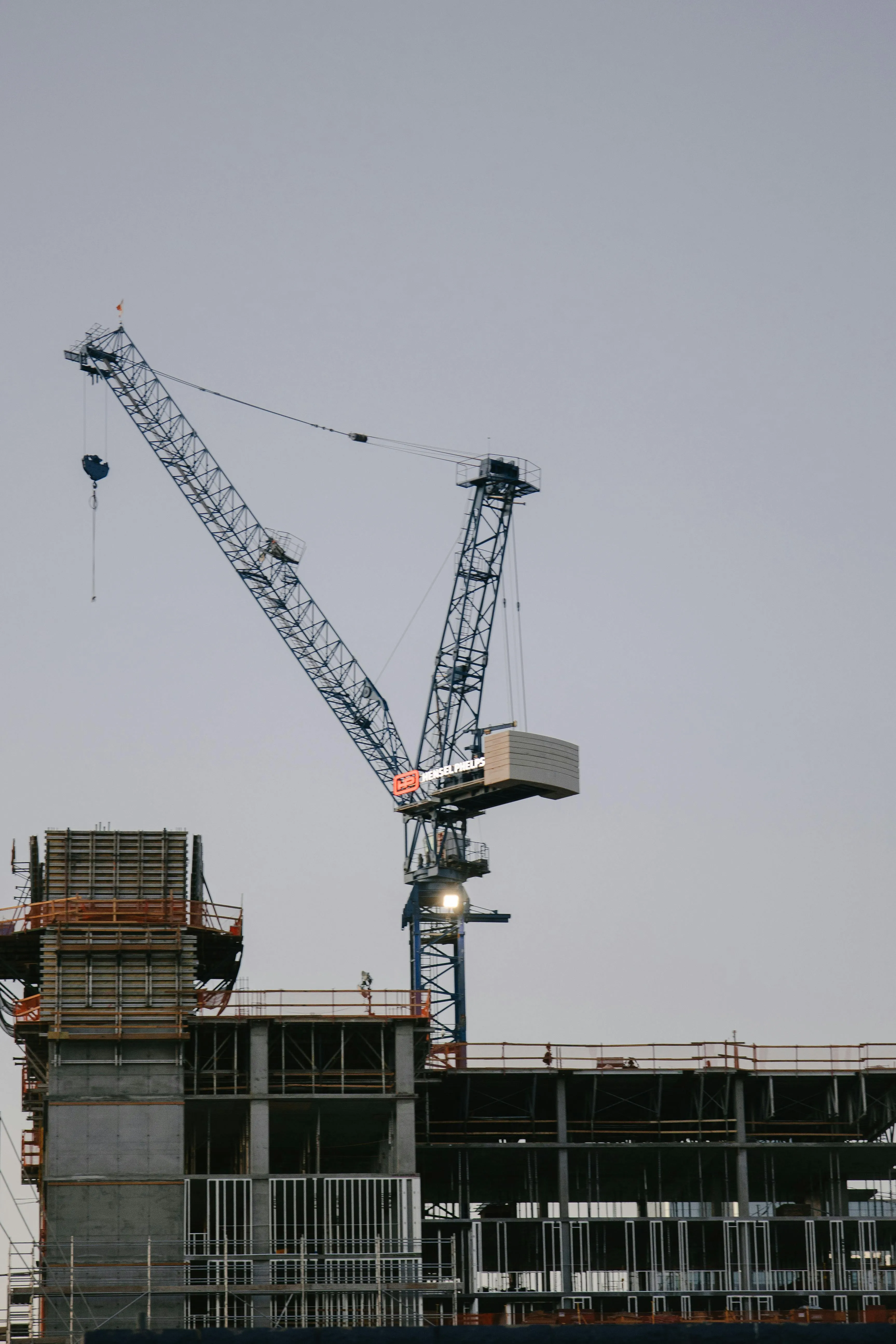 A construction crane looming over a project site