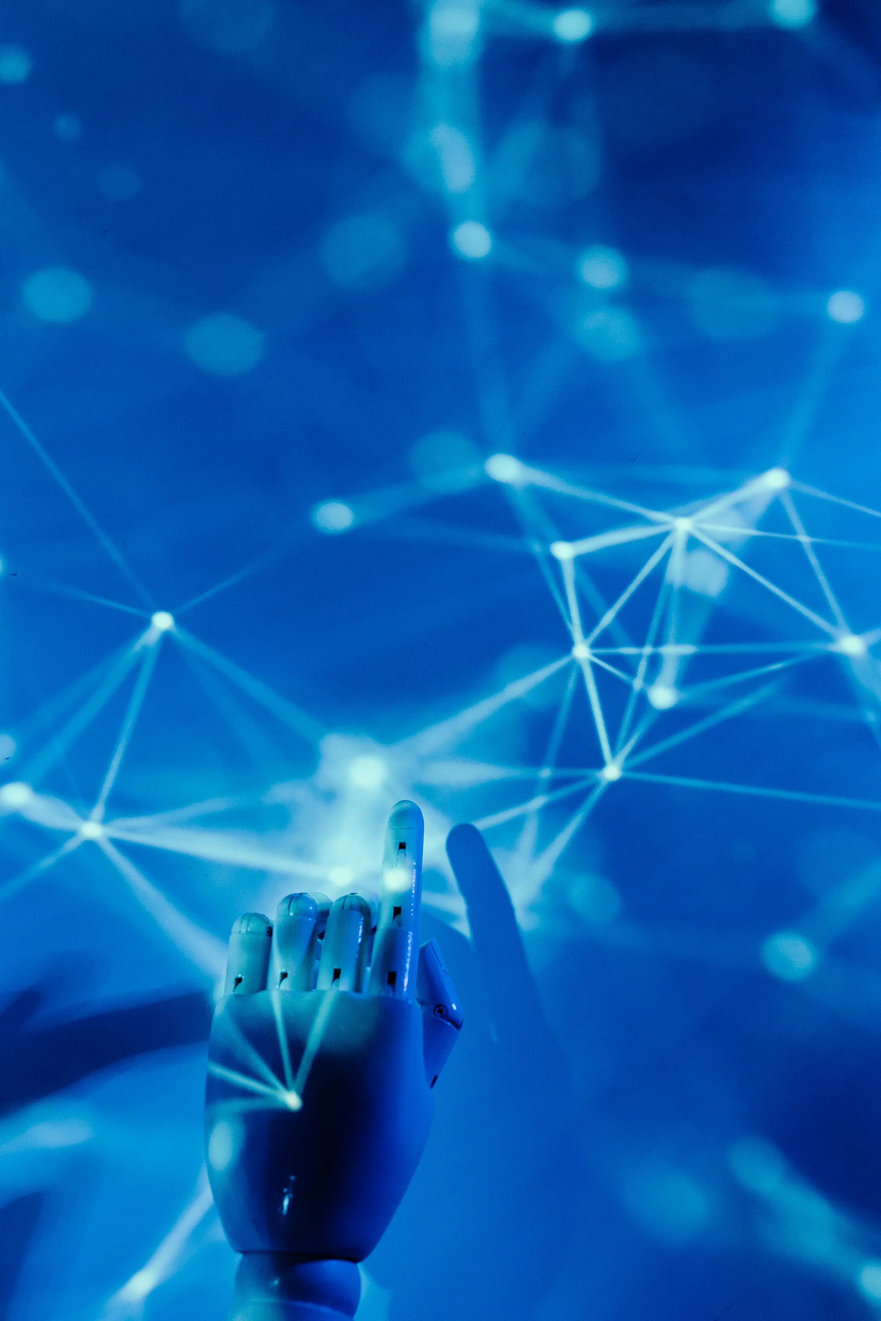 A robot hand touching a blue energy web