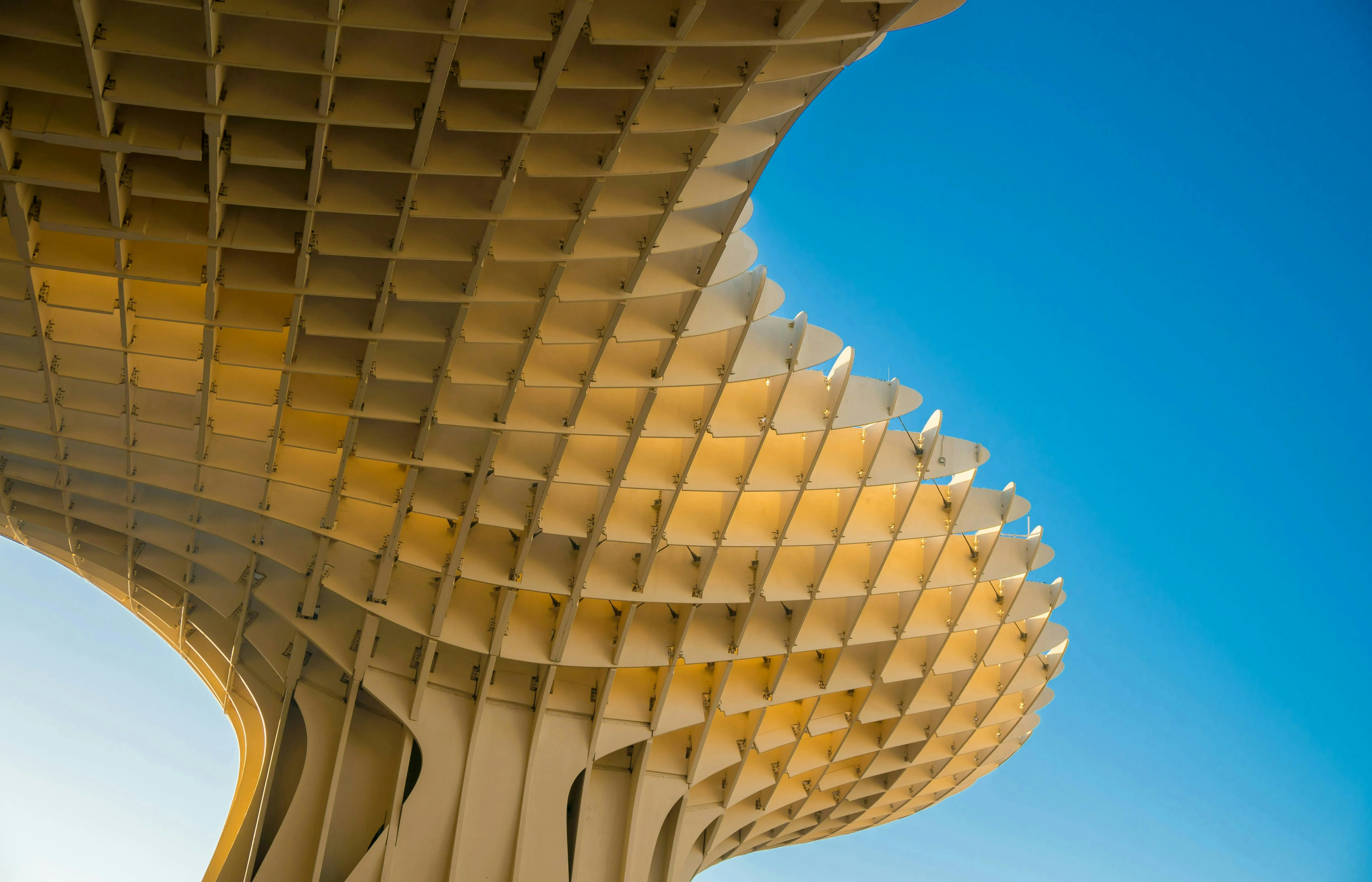 Geometric architecture against a blue sky