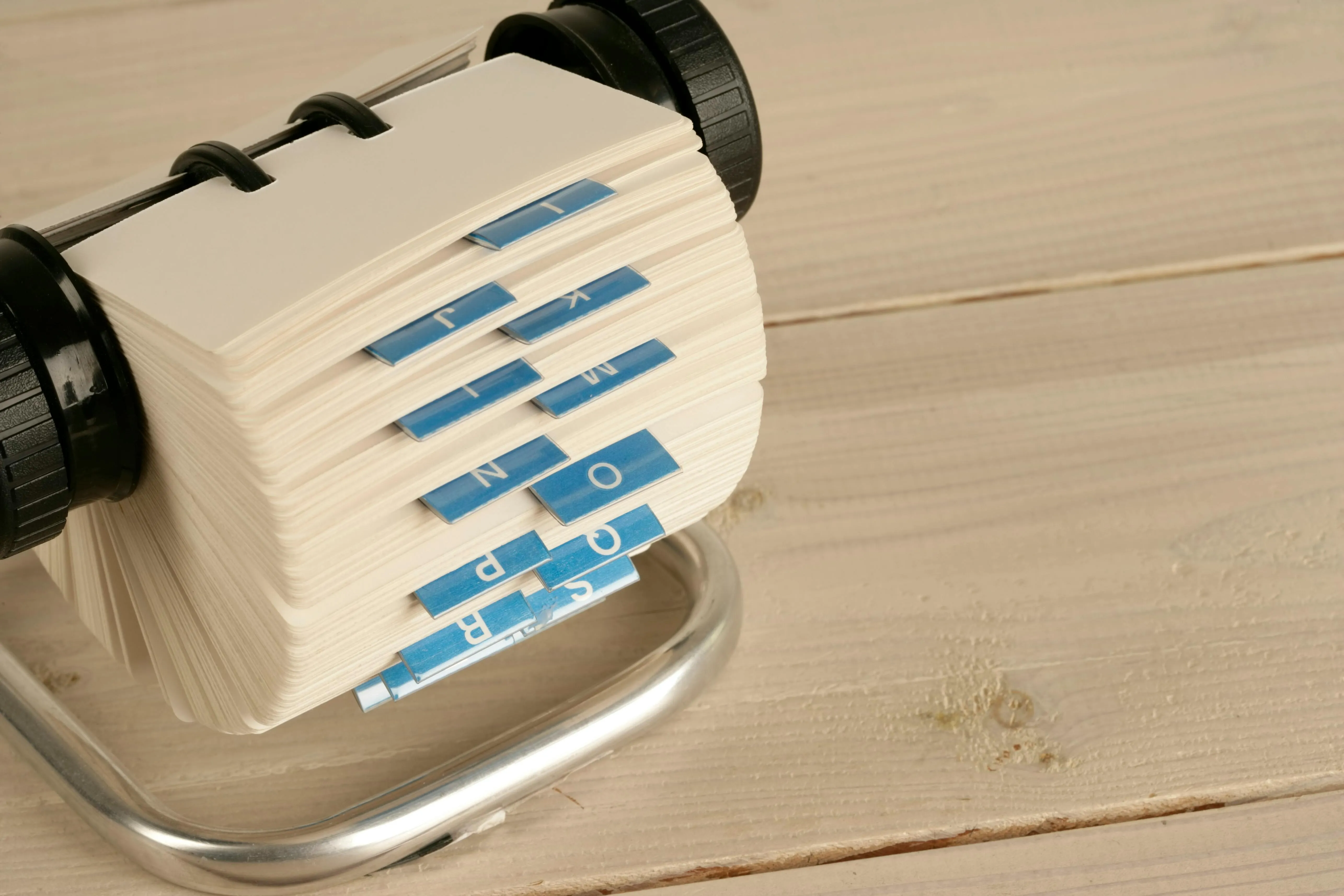 Paper index cards organizing information on a desk