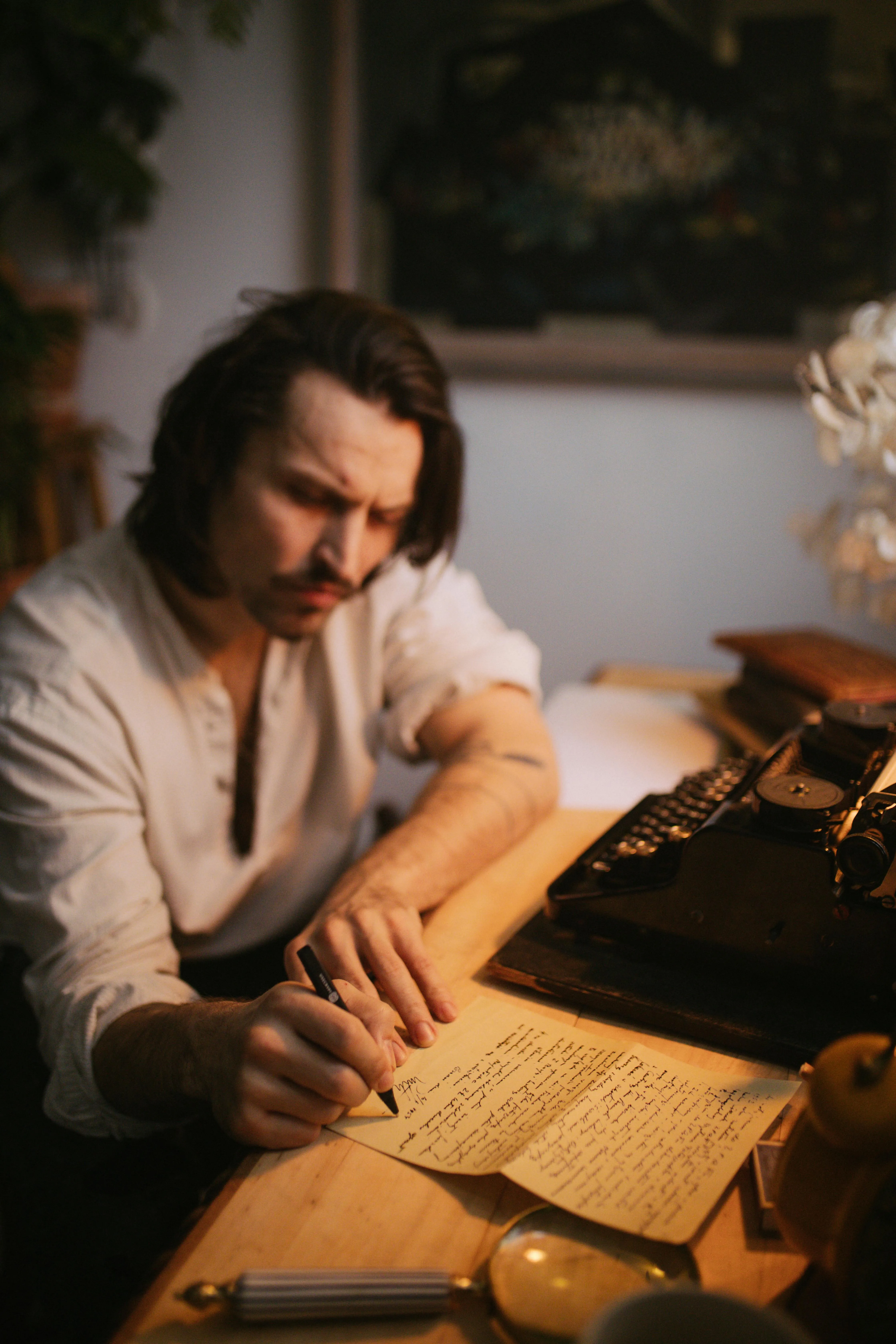 Someone in the flow of traditional writing at a desk